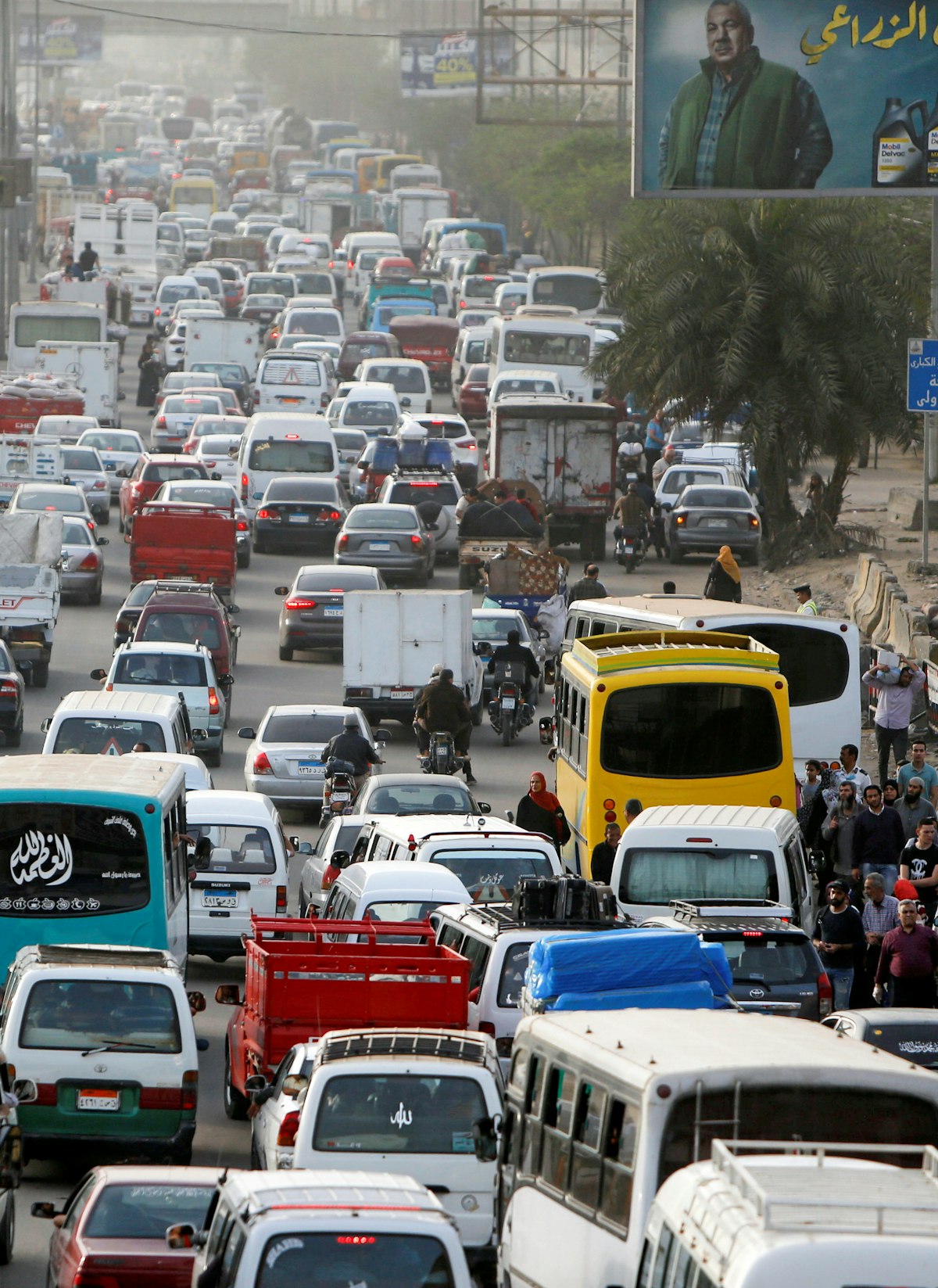 Cars are stuck in a traffic jam before curfew to contain the spread of the coronavirus disease (COVID-19), in Shubra El Kheima, Al Qalyubia Governorate, north of Cairo - REUTERS